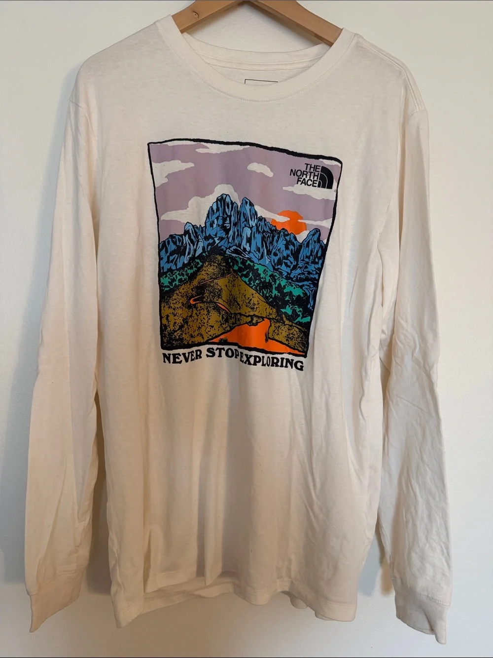 The North Face Cream Long Sleeve Graphic Tee with Multicolor Mountain Print